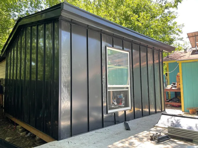 Black standing seam metal wall panels for Roof Inspection in Caddo Mills