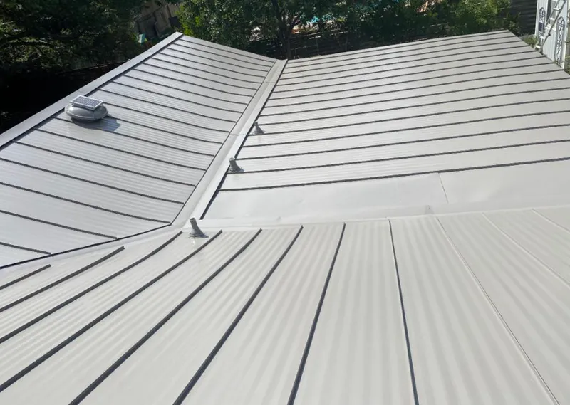 Solar attic fan installed on a metal roof for Roof Ventilation in Caddo Mills